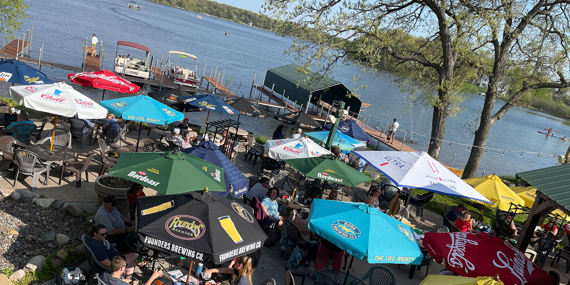 People Sitting By Lake