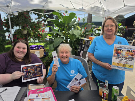Women Holding Raffle Tickets